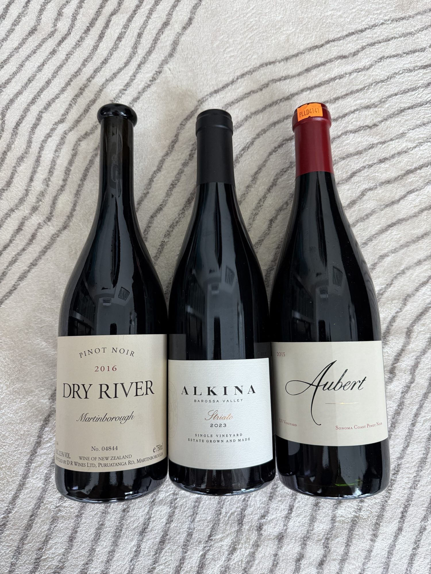 Dry River 2016, Alkina’s Syrah 2023, and Aubert’s UV Vineyard Pinot Noir 2015.